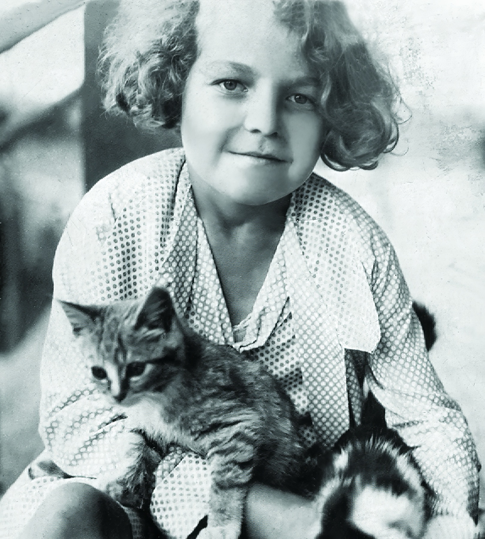 Hazel McCallion as a young child, holding a cat.