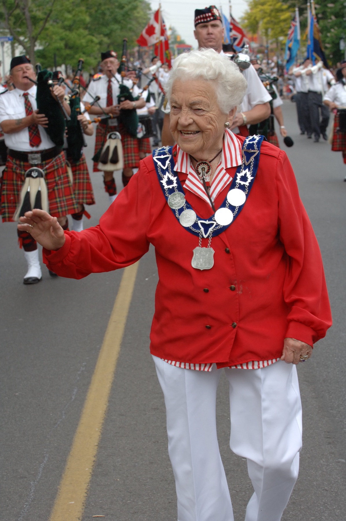 Hazel McCallion greeting crowds at a Mississauga parade.