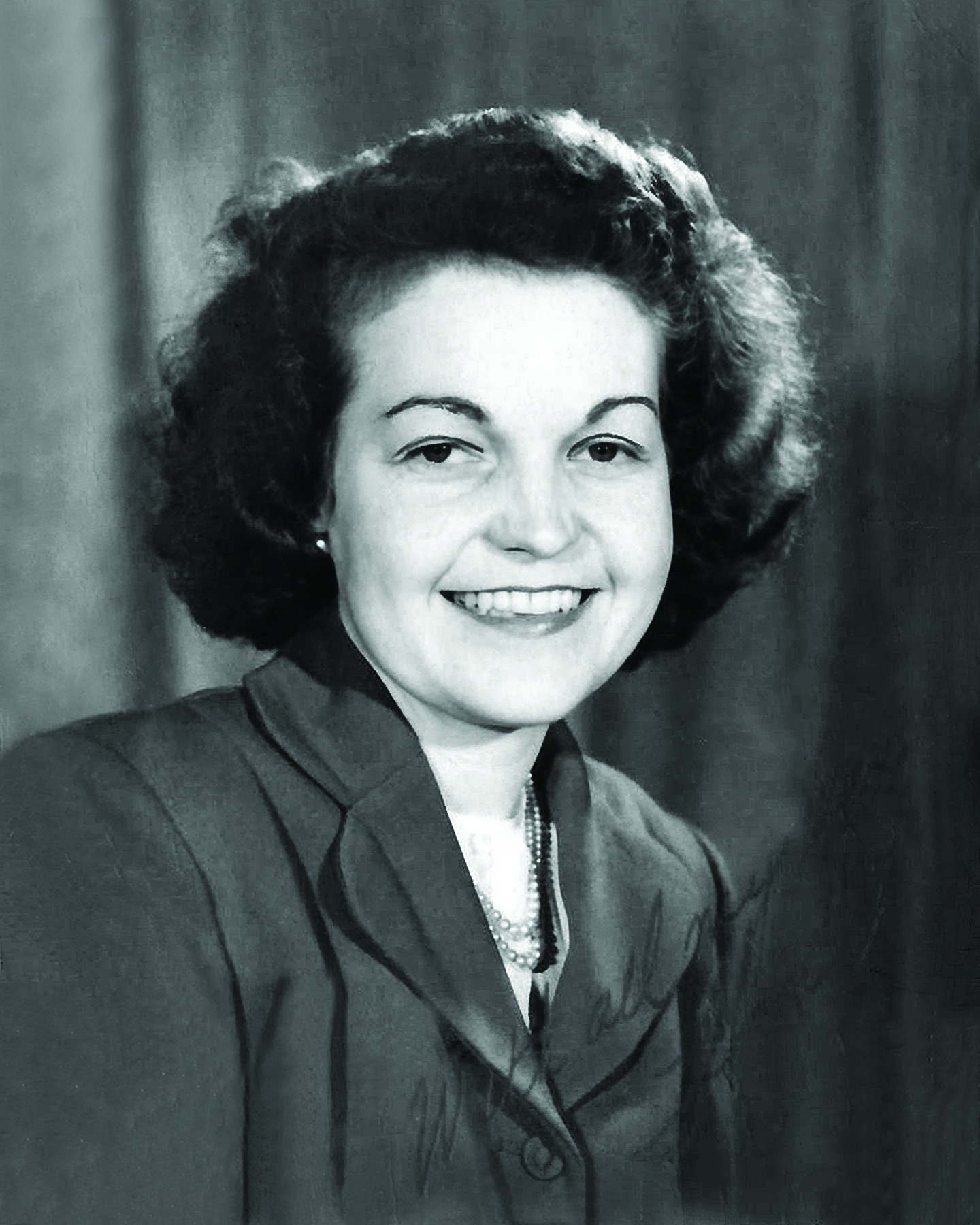 A formal black-and-white portrait of Hazel McCallion as a young woman.