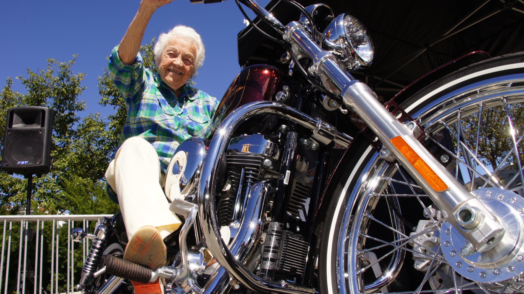 Hazel McCallion seated on a motorcycle.